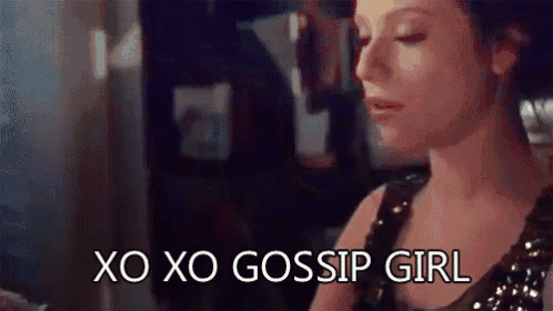 a woman is sitting at a table with her eyes closed and the words `` xo xo gossip girl '' written on her face .