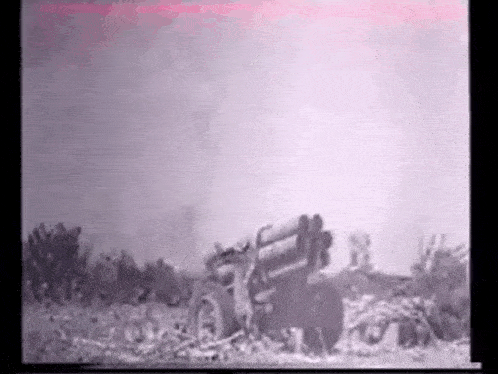 a black and white photo of a military vehicle shooting a rocket .
