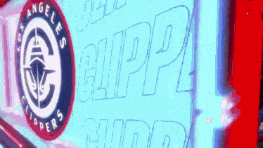 a sign for the los angeles clippers is lit up in blue