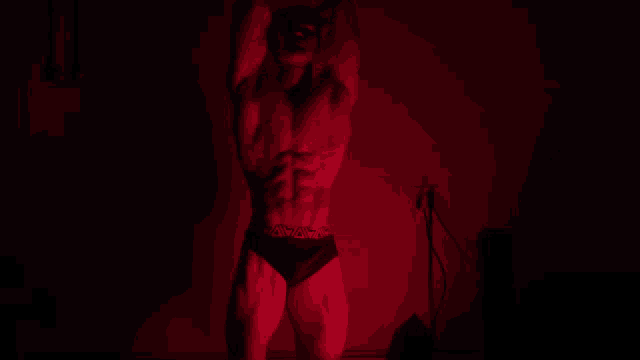 a man in black underwear with the word calvin klein on it