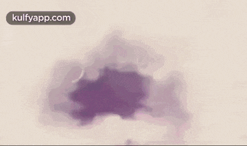 a bunch of purple clouds are floating in the air