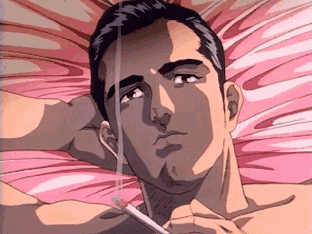 a man is laying on a bed with a cigarette in his hand