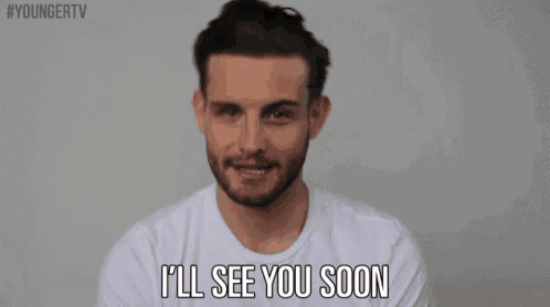 a man with a beard is smiling and says i 'll see you soon