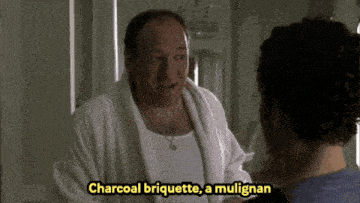 a man in a white robe is talking to another man with the words charcoal briquette a mulligan below him