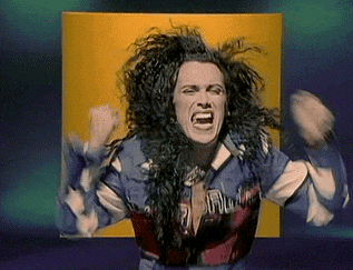 a woman with long curly hair is screaming in front of a yellow and blue background .