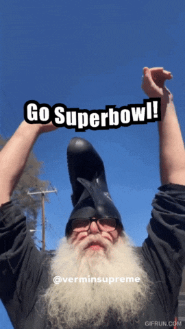 a man with a beard wearing a helmet that says go superbowl on it