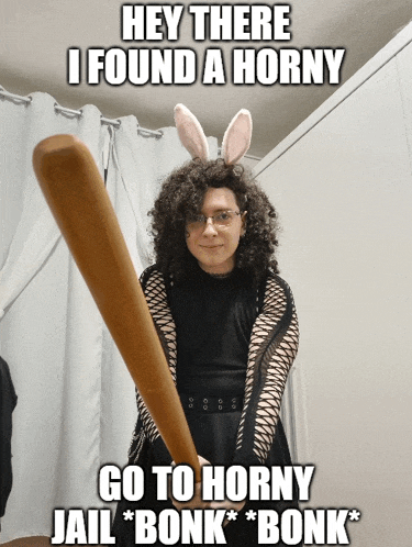 a woman wearing bunny ears is holding a baseball bat and says hey there i found a horny go to horny
