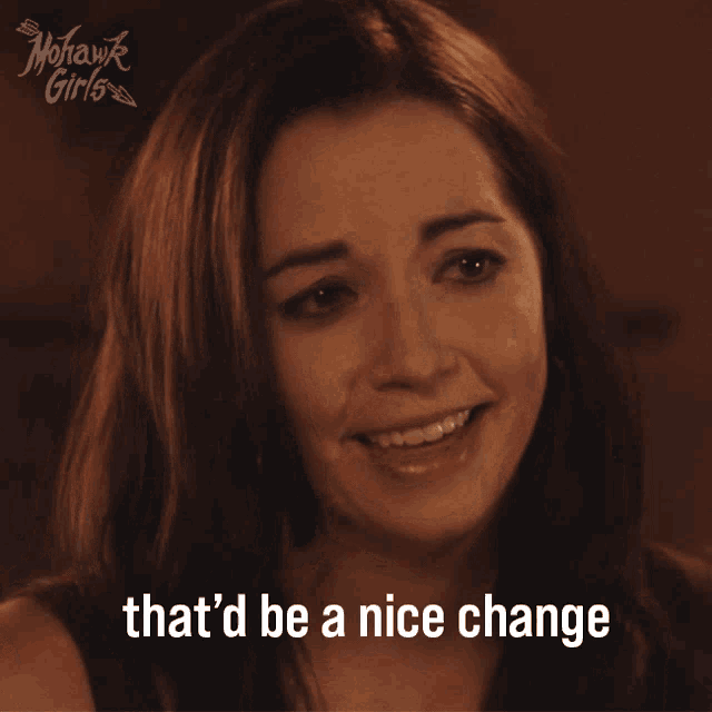 a woman is smiling with the words that 'd be a nice change below her