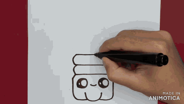 a person is drawing a cartoon character on a piece of paper that is made in animotica