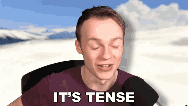 a man says it 's tense in front of a mountain