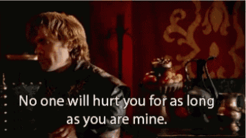 a man is sitting at a table with a quote that says no one will hurt you for as long as you are mine