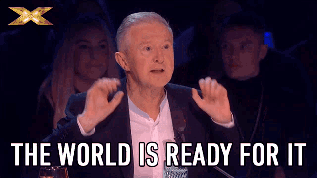 a man speaking into a microphone with the words " the world is ready for it " above him