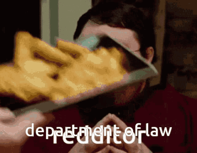 a man is holding a knife in front of his face and the words department of law are below him
