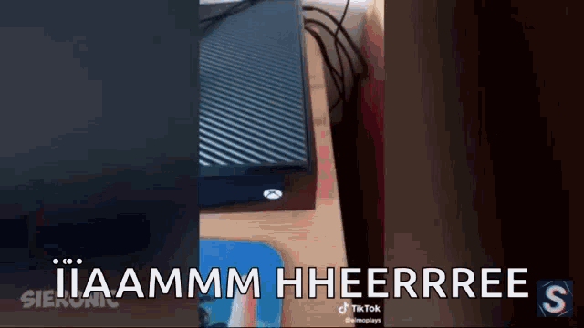 a video of a xbox on a table with the caption iiaammm hheerree s .