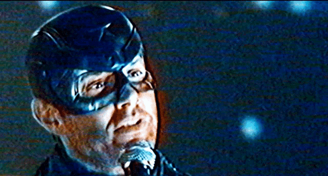 a close up of a man in a captain america mask