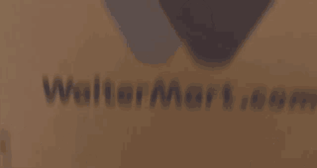 a man is standing in front of a cardboard box with a heart on it .