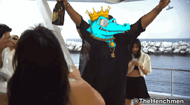 a man with a crown on his head is holding a bottle of champagne in his hands