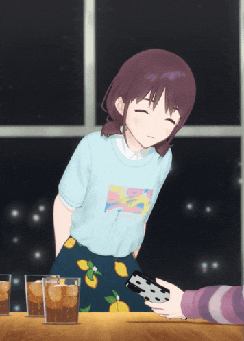 a girl wearing a blue shirt that says ' strawberry ' on it