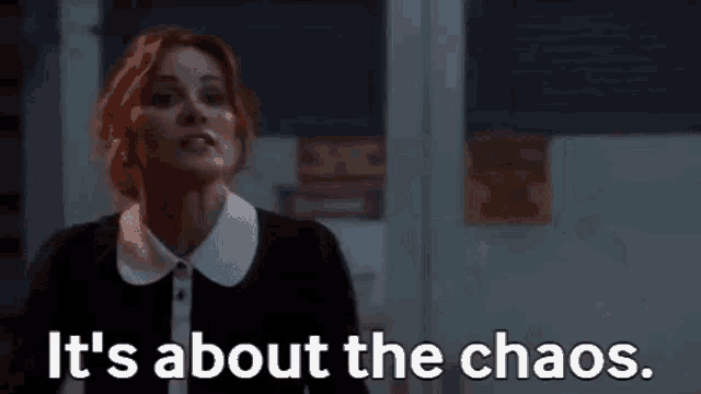 a woman is holding a ring and says `` it 's about the chaos '' .