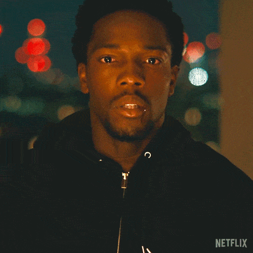 a blurred image of a city at night with netflix written on the bottom