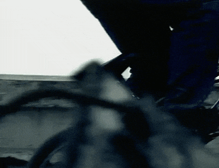 a close up of a person riding a bike with a white background