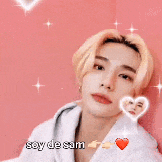 a picture of a young man with hearts around his face and the words soy de sam