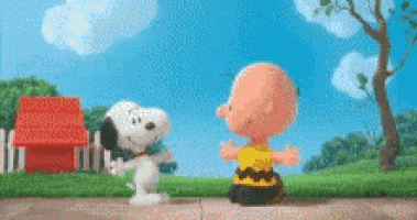 snoopy and charlie brown are standing next to each other on the sidewalk .