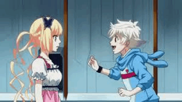 a boy and a girl are standing next to each other .