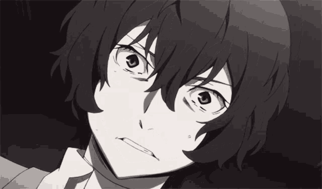 a close up of a person 's face with a serious look on his face