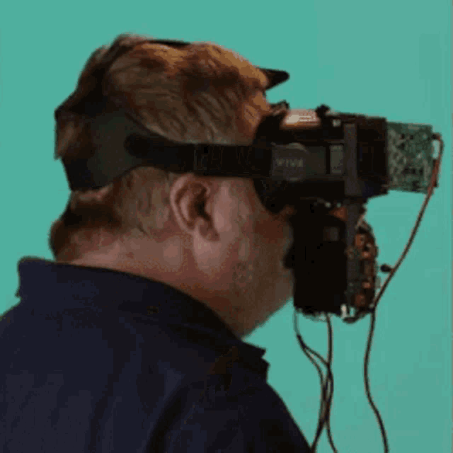 a man wearing a virtual reality headset that says vive