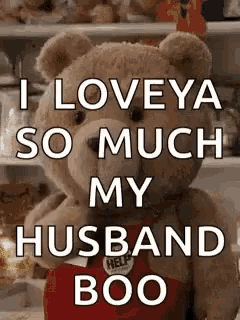 a teddy bear is standing in front of a refrigerator with the words `` i love ya so much my husband boo '' .