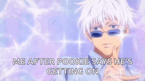a man with white hair and blue sunglasses is pointing at something .
