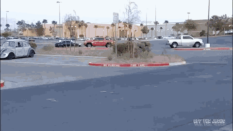 a parking lot has a no parking fire lane sign