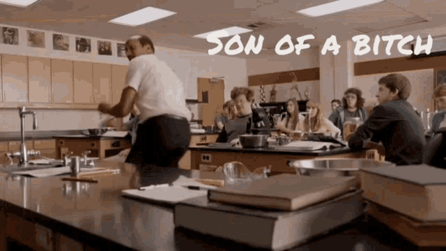 a man dancing in a classroom with the words son of a bitch written above him