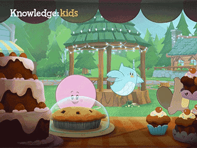 a knowledge kids cartoon shows a pie and cupcakes on a table