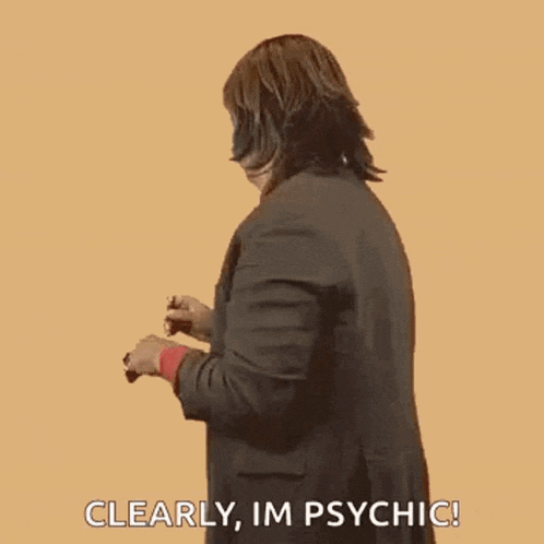 a woman in a suit and tie is making a funny face and saying clearly , im psychic .