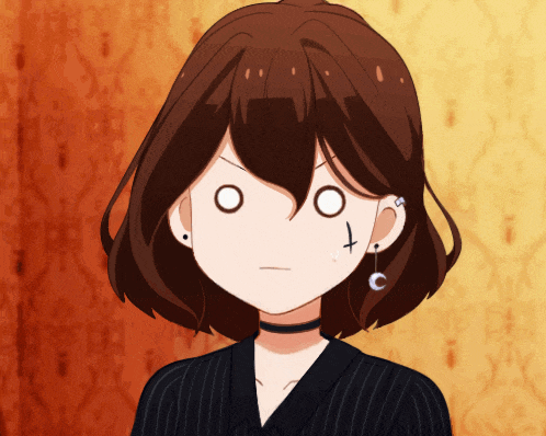 a girl with a cross piercing in her ear looks angry