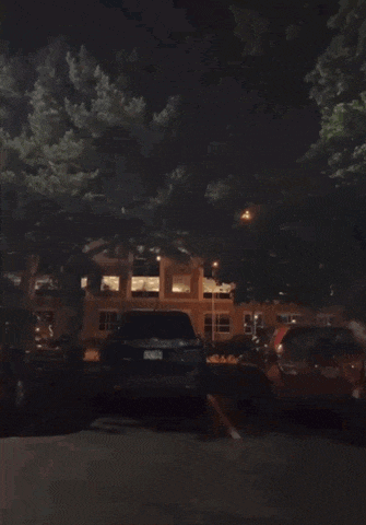 a blurred image of a person running down a street