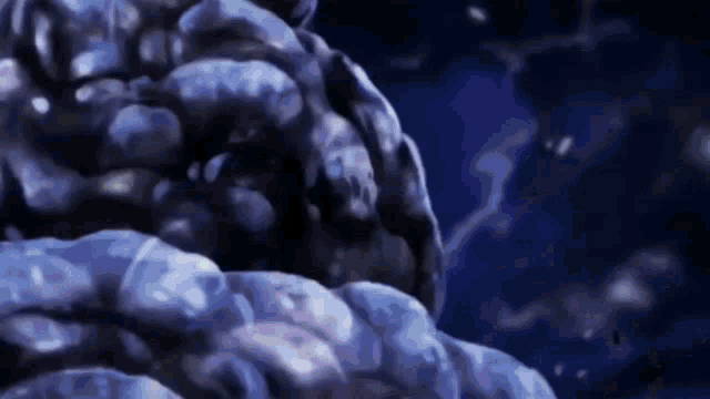 a close up of a blue object in the dark