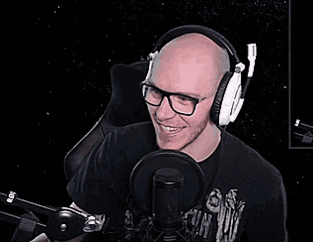 a man wearing headphones and a t-shirt that says fly on it