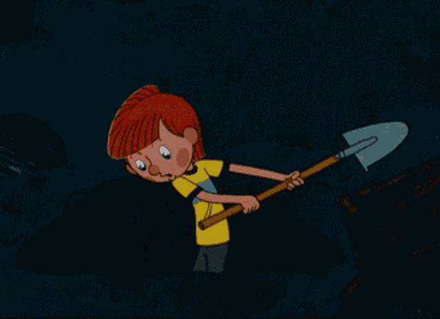 a boy with red hair is holding a shovel in his hands