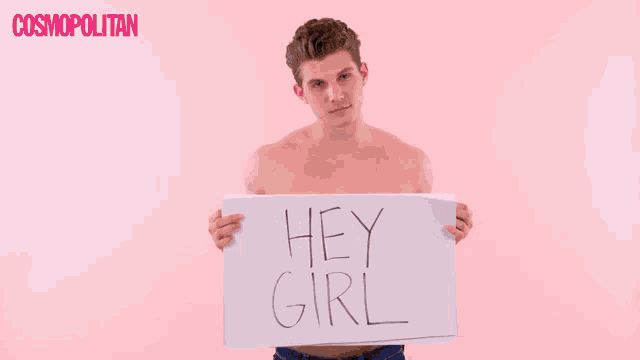 a shirtless man is holding up a sign that says to me you are perfect