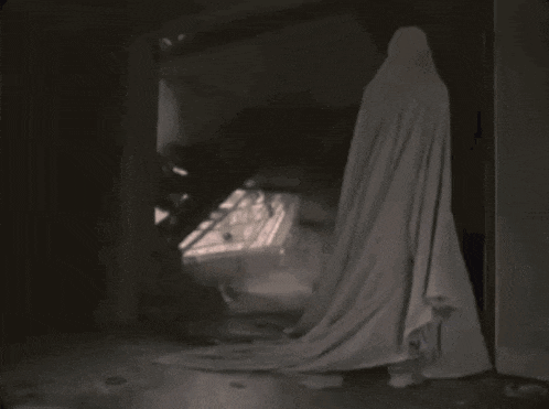 a ghost is coming out of a doorway in a dark room with smoke coming out of it