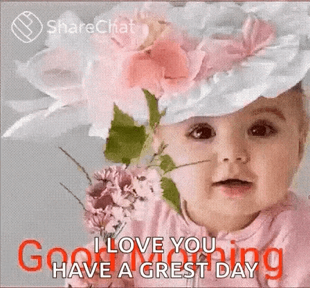 a baby wearing a hat with flowers on it and a bouquet of flowers .