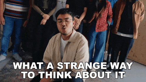 a group of people standing around a man with the words " what a strange way to think about it "