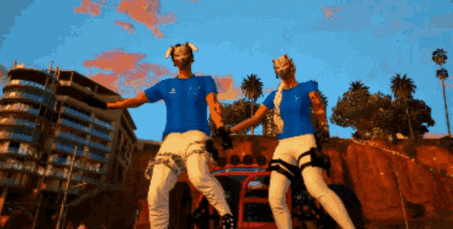 a man and a woman are dancing in front of a building