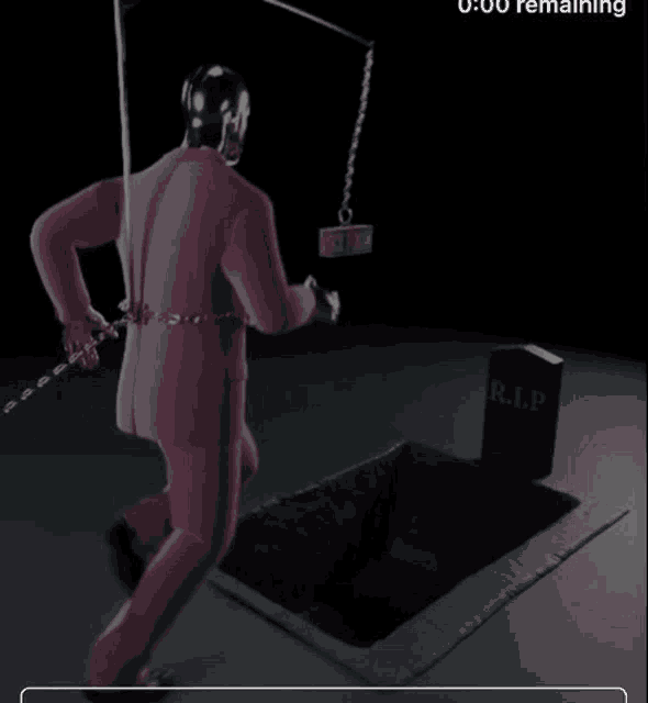 a man in a pink suit is running towards a grave with a chain around his neck