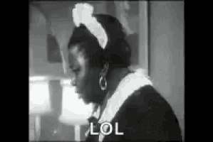 a black and white photo of a woman wearing a maid 's headband .