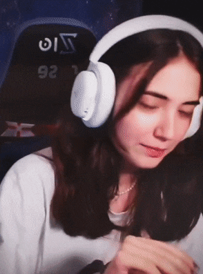 a woman wearing headphones with the number 92 on the back