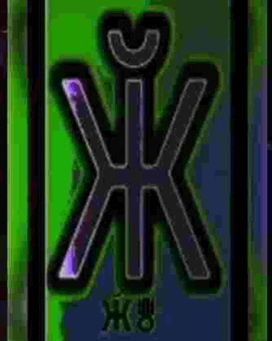 a close up of a green and purple logo on a green background .